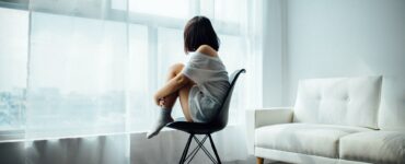 Girl Looking Outside of Window