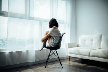 Girl Looking Outside of Window