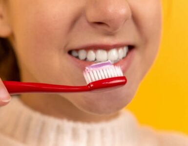 girl holding toothbrush