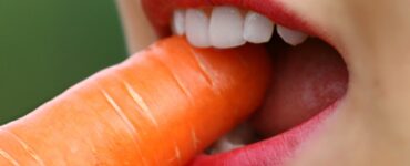 girl eating carrot